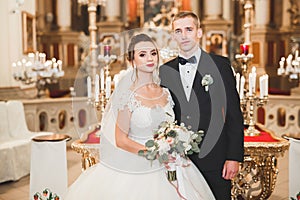 Wedding couple bide and groom get married in a church photo