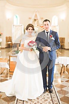 Wedding couple bide and groom get married in a church photo