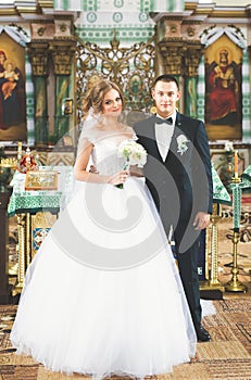 Wedding couple bide and groom get married in a church photo