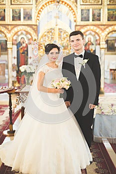 Wedding couple bide and groom get married in a church photo