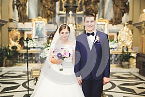 Wedding couple bide and groom get married in a church photo