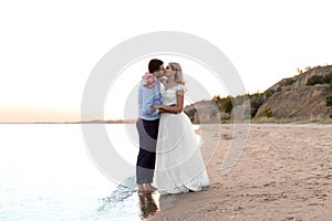 Wedding couple. Bride and groom kissing