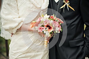 Wedding couple with brides bouquet