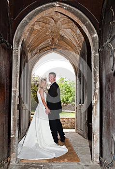 Wedding couple in church entrance