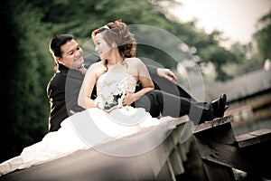 wedding couple enjoying romantic moments outsides on a summer. Happy bride and groom on their wedding.