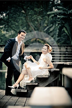 Wedding couple enjoying romantic moments outsides on a summer. Happy bride and groom on their wedding.