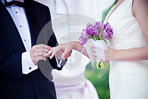 Wedding couple exchanging rings ceremony