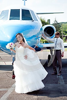 Wedding couple fly on honeymoon