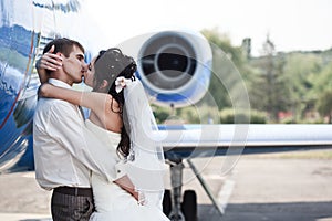 Wedding couple fly on honeymoon