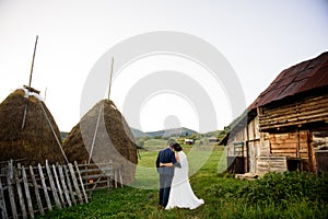 Wedding couple on a green field