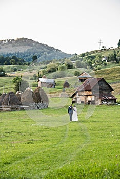 Wedding couple on a green field