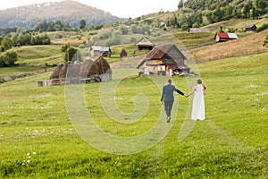 Wedding couple on a green field