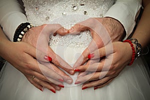 Wedding couple hands like heart