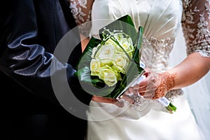 Wedding couple holding bouquet