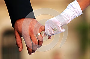 Wedding couple holding hands