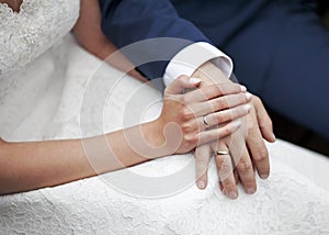 Wedding couple holding hands