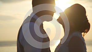 Wedding Couple Kissing at Sunset on the Beach