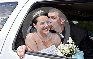 Wedding couple in Limousine