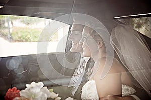 Wedding couple in Limousine