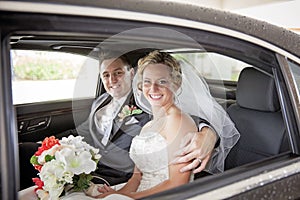 Wedding couple in Limousine