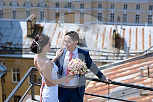 Wedding couple on the nature is hugging each other