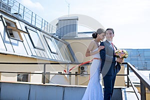 Wedding couple on the nature is hugging each other