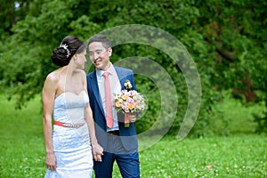 Wedding couple on the nature is walking