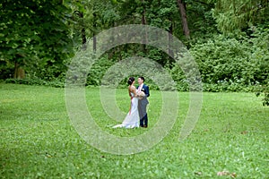 Wedding couple on the nature is walking