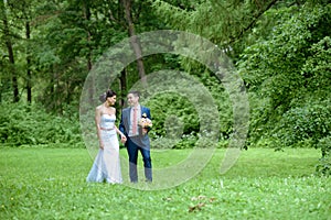 Wedding couple on the nature is walking