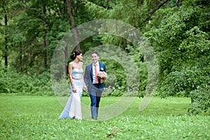 Wedding couple on the nature is walking