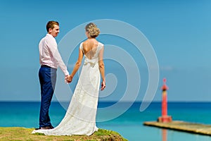 A wedding couple near the ocean