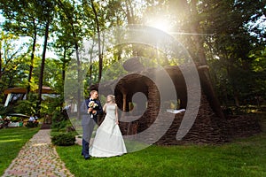 Wedding couple near summer house