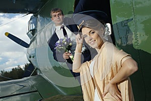 Wedding couple near vintage aircraft