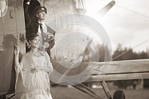 Wedding couple near vintage aircraft