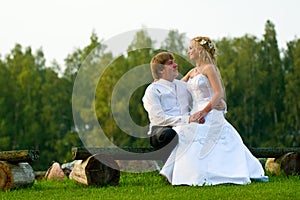 Wedding couple on park bench