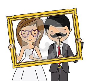 Wedding couple with a photocall frame