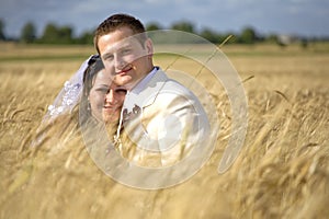 Wedding couple among rye fertility