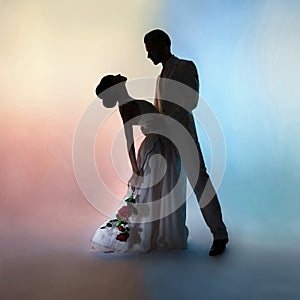 Wedding couple silhouette groom and bride on colors background