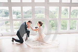 Wedding couple on the studio. Wedding day. Happy young bride and groom on their wedding day. Wedding couple - new family.