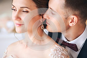 Wedding couple on the studio. Wedding day. Happy young bride and groom on their wedding day. Wedding couple - new family.