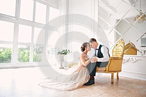 Wedding couple on the studio. Wedding day. Happy young bride and groom on their wedding day. Wedding couple - new family.