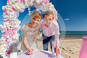 A wedding couple on a sunny beach