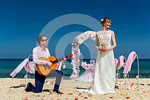 A wedding couple on a sunny beach