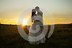 Wedding couple on sunset