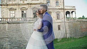 Wedding couple walks and poses near the ancient castle 4K