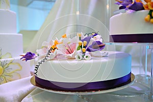 Wedding cake glazed with white chocolate photo