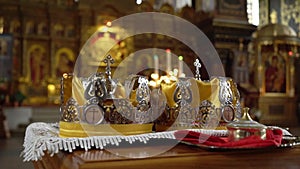 Wedding crowns. The wedding in the Church. Marriage ceremony in a Christian Church. The priest, the bride and groom
