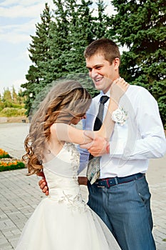 Wedding Day. Beautiful Bride in the Arms of the Groom. Happy Fun Coulple