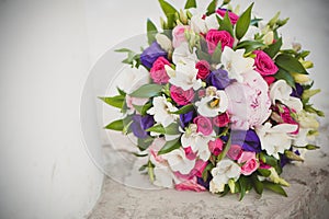 Wedding day, the bride`s bouquet, bridal bouquet with wedding rings, wedding rings