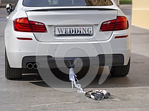 Wedding day car is waiting for groom and bride